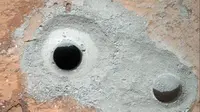 NASA merilis potret lubang misterius yang ditemukan di Planet Mars. (AP)