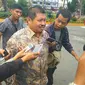 Bupati Bengkalis Amril Mukminin setelah diperiksa penyidik KPK di Mako Brimob Polda Riau beberapa waktu lalu. (Liputan6.com/M Syukur)