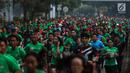 Sejumlah peserta mengikuti Lomba lari MILO Jakarta International 10K 2017 di Jakarta, Minggu (23/7). MILO Jakarta International 10K 2017 melombakan tiga kategori yakni 10K, 5K dan Family Run 1,7K. (Liputan6.com/Faizal Fanani)