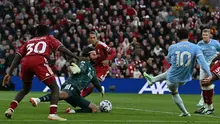 Gelandang asal Prancis milik Manchester City, Rayan Cherki (nomor punggung 10), melepaskan tembakan yang mencetak gol ketiga timnya dalam pertandingan Liga Inggris antara Liverpool dan Manchester City di Anfield, Liverpool, Inggris barat laut, pada 11 Oktober 2026. (Paul ELLIS/AFP)