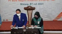 BNI dan Universitas Negeri Malang menandatangani Perjanjian Kerjasama Layanan Pembukaan Rekening Giro Kerjasama Berbasis Kartu Debit. (Foto: BNI)