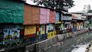 Mural menghiasi Kampung Unggulan, Tanah abang, Jakarta, Selasa (6/12/2022). Pembuatan mural sepanjang 100 meter di kampung unggulan tersebut sudah dilakukan awal november 2022 dan program dari Pemerintah Provinsi DKI Jakarta. (Liputan6.com/Johan Tallo)