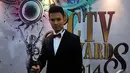 Fero Walandouw raih penghargaan Aktor Pendamping Paling Ngetop di ajang SCTV Awards 2014. Foto diambil pada Sabtu (29/11/2014). (Liputan6.com/Johan Tallo)