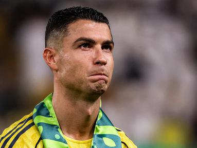 Cristiano Ronaldo merasa diperlakukan tidak adil oleh pemilik klub, PIF. Ia merasa Al-Nassr dianaktirikan dibanding klub raksasa lainnya seperti Al-Hilal. (AFP/Fayez Nureldine)