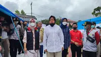 Menteri Sosial (Mensos) Tri Rismaharini mengunjungi dapur umum Kemensos di Pacet, Cianjur, Sabtu (26/11/2022). (Liputan6/Achmad Sudarno)