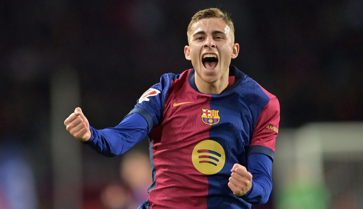 Pemain Barcelona, Fermin Lopez melakukan selebrasi setelah mencetak gol ke gawang Valencia pada laga lanjutan Liga Spanyol 2024/2025 di Estadi Olimpic Lluis Companys, Barcelona, Spanyol, Senin (27/01/2025) dini hari WIB. (AFP/Manaure Quintero)