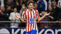 Penyerang Atletico Madrid asal Argentina #19, Julian Alvarez, merayakan gol ketiganya dalam pertandingan Liga Spanyol antara Atletico Madrid dan Rayo Vallecano di Stadion Metropolitano, Madrid, Kamis (25-9-2025). (Javier SORIANO/AFP)