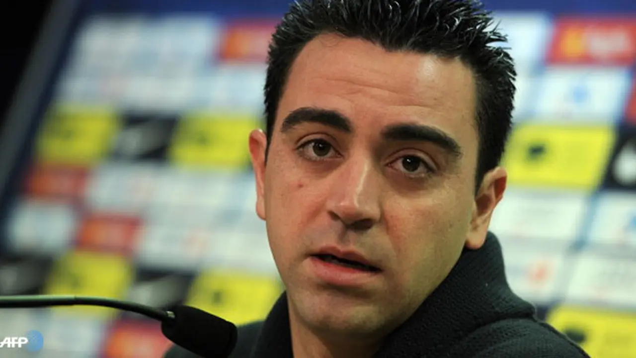 xavi-hernandez-130308-logo.jpg