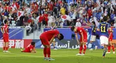 Reaksi kecewa sejumlah pemain Vietnam usai gawang timnya dibobol pemain Jepang Keito Nakamura pada laga Grup D Piala Asia 2023 di Stadion Al Thumama, Qatar, Minggu (14/1/2024).  (AFP/Karim Jaafar)