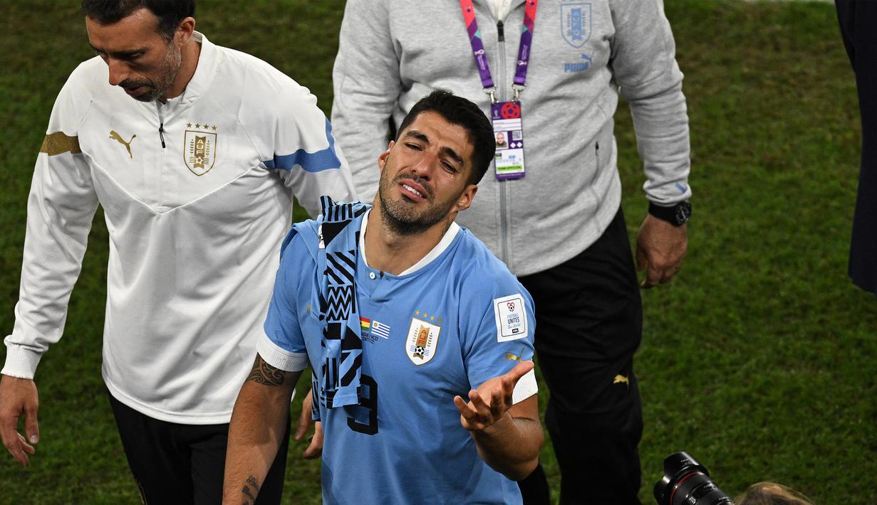 Sedangkan Uruguay harus menangis setelah kemenangan 2-0 atas Ghana tak berarti apa-apa. (AFP/Philip Fong)