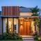 Desain Tampak Depan Rumah Minimalis Modern dengan Perpaduan Kayu. (Foto: AI)