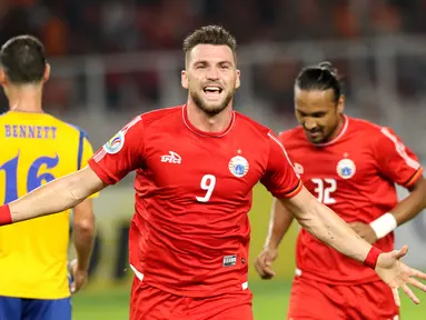 Pemain Persija Marko Simic berlari merayakan gol yang dicetaknya ke gawang Tampines Rovers pada laga grup H Piala AFC 2018 di Stadion GBK, Jakarta, Rabu (28/2). Babak pertama Persija unggul 2-0. (Liputan6.com/Helmi Fithriansyah)