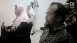 Kuasa hukum penyanyi Opick, Ismar Syafruddin (kanan) dan kuasa hukum Dian Rositaningrum, Ina Rachman (kiri) menghadiri sidang putusan cerai di Pengadilan Agama Jakarta Timur, Selasa (10/7). Sidang ditunda pada 24 Juli 2018. (Liputan6.com/Faizal Fanani)