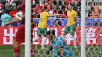 Selebrasi penyerang Australia, Craig Goodwin usai membobol gawang Timnas Indonesia pada babak 16 besar Piala Asia 2023 di Stadion Jassim bin Hamad, Minggu (28/1/2024), (HECTOR RETAMAL / AFP)