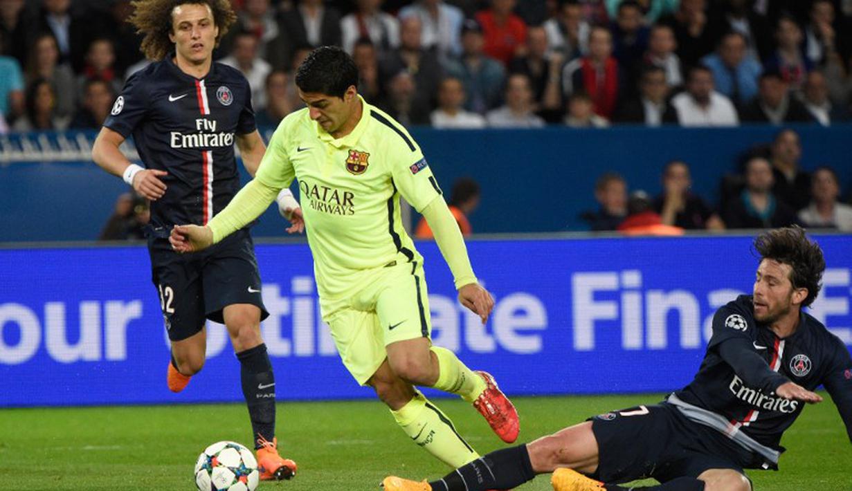 Aksi Luis Suarez Mencetak Angka. AFP PHOTO / FRANCK FIFE 