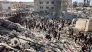 Meski tanpa menyertai bukti kuat, Israel mengklaim bahwa gedung-gedung tersebut digunakan oleh milisi Hamas. (Omar AL-QATTAA/AFP)