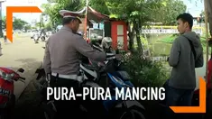 Coba kabur dari razia pajak oleh petugas gabungan, beberapa pengendara motor pura-pura mancing.