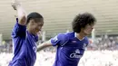 Everton's Marouane Fellaini celebrates after scoring a goal against Sunderland with teammate Steven Pienaar during their EPL football match at the Stadium of Light on May 3, 2009. AFP PHOTO/GRAHAM STUART