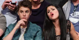 Justin Bieber mengekspresikan rasa cintanya pada Selena Gomez dengan menggamar tato wajah Selena di pergelangan tangan kirinya. (hit.com.au)