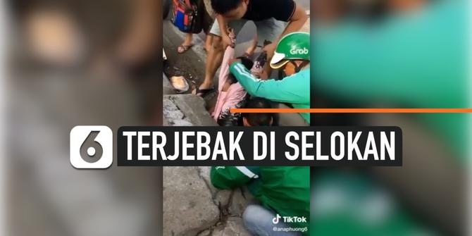 VIDEO: Bocah Perempuan Terjebak di Selokan, Penyelamatan Dibantu Driver Ojol