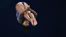 Lariesa Garina Haga bertanding pada babak penyisihan nomor loncat indah 3 meter putri pada Kejuaraan Akuatik Dunia 2024 di Hamad Aquatics Center, Doha, Qatar, 8 Februari 2024. (AFP/Sebastien Bozon)