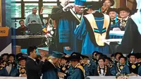 Menteri Pekerjaan Umum dan Perumahan Rakyat (PUPR) Basuki Hadimuljono, dianugerahi gelar Doktor Kehormatan (Honoris Causa) dari Institut Teknologi Bandung (ITB), Kamis (16/1/2020). (Liputan6.com/Huyogo Simbolon)
