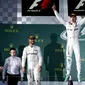 Teriakan kebahagiaan Nico Rosberg saat menjuarai seri pertama musim balap 2016 di Australia, Minggu (20/3/2016). Podium 2 dan 3 ditempati Lewis Hamilton dan Sebastian Vettel. (Reuters/Brandon Malone)