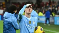 Gelandang serang Manchester City, Phil Foden mencatat hattrick ke gawang Brentford pada pekan ke-23 Liga Inggris 2023/2024, Selasa (6/2/2024) dini hari WIB. (BEN STANSALL / AFP)