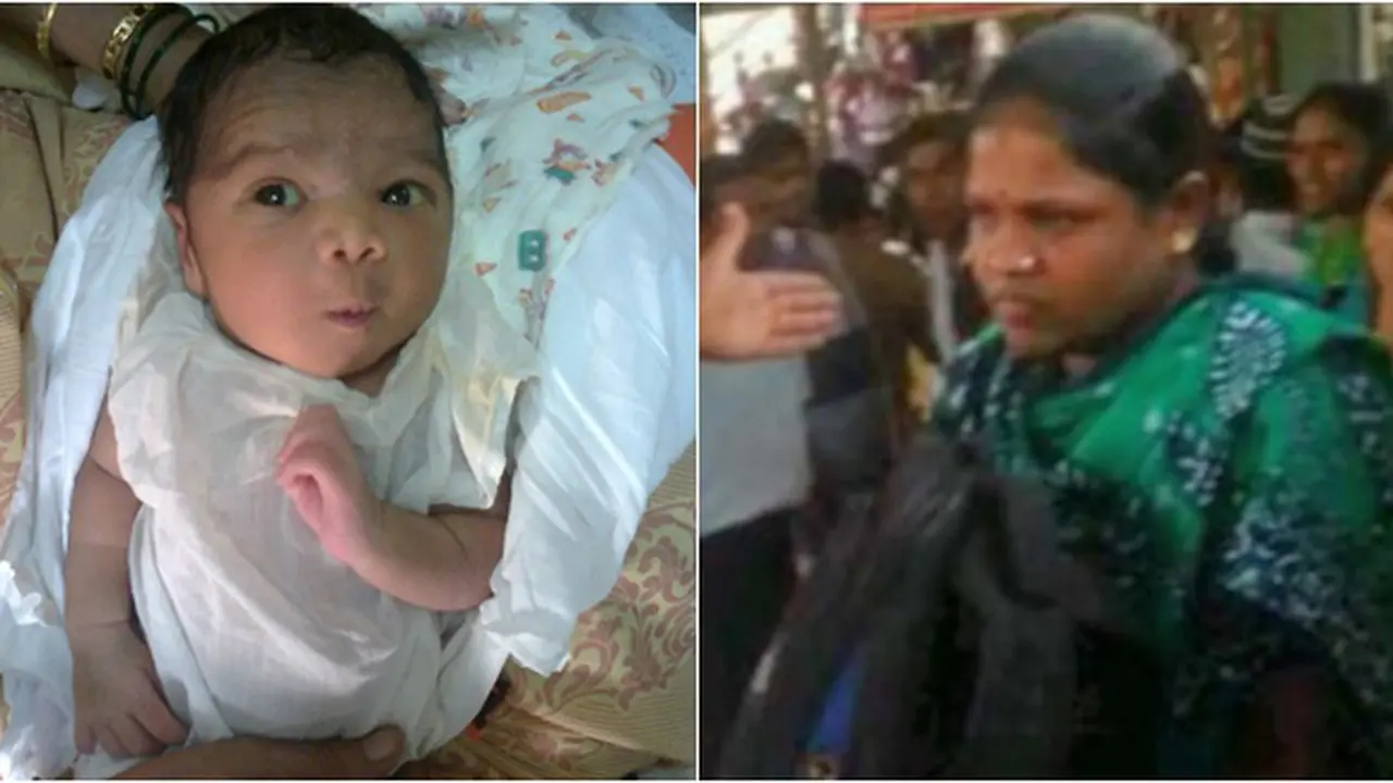 Bayi dan petugas rumah penampungan| Photo copyright Dailymail.co.uk